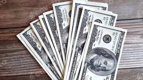 Preview: Stack of One Hundred Dollar Bills on Wood