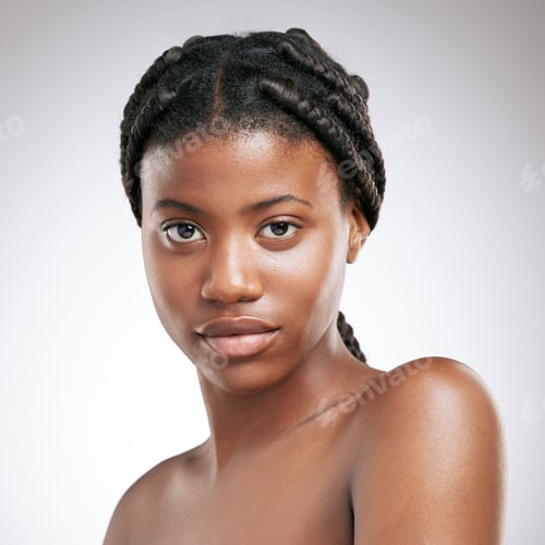 Preview: Cropped portrait of an attractive young woman posing in studio against a grey background