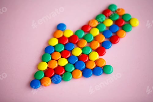 Preview: Pointer on the Pink Background. Colored Candy. Diet. Healthful N