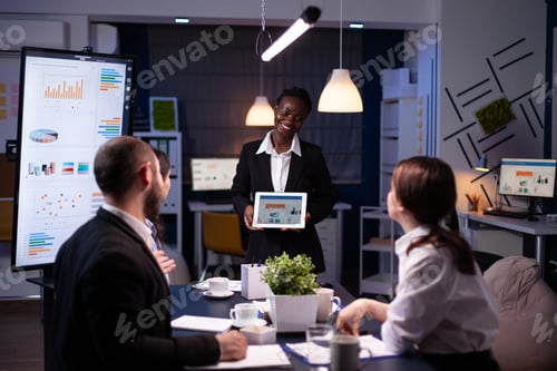 Preview: Focused workaholic entrepreneur woman with dark skin explaining management strategy