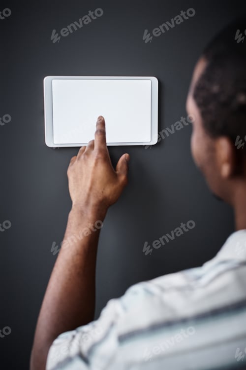 Preview: Man Tapping On Domotics Control Panel
