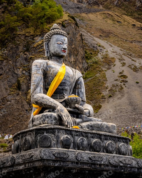 Preview: Vertical shot of a statue of The Holy Tibetan Buddha shrine of Muktinath Upper Mustang, Nepal
