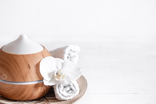Preview: Spa composition with aroma diffuser, towel and orchid flower as decor.