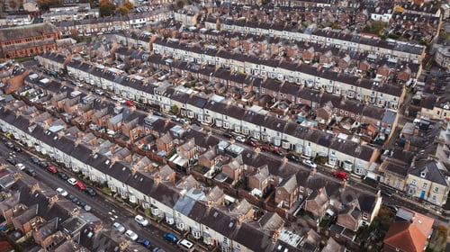 Preview: Aerial view above rows of back to back terraced houses on a large council estate in the UK