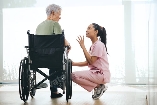 Preview: Shot of a young nurse caring for an older woman in a wheelchair