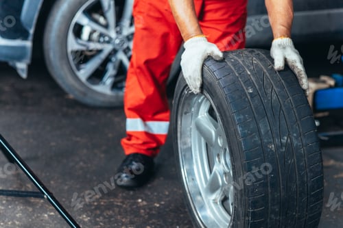 Preview: Mechanic Rolling Car Tire