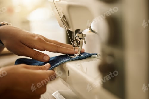 Preview: Zoom into hands of a seamstress sewing a piece of fabric. Fashion designer stitching a piece of fab