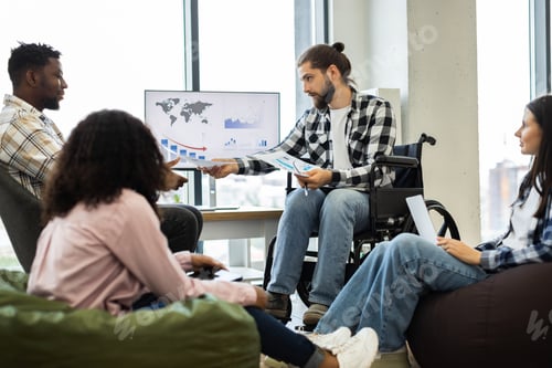 Preview: Diverse team collaboration in modern office environment discussing reports