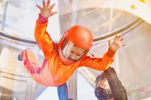 Preview: Boy flying in wind tunnel with instructor.