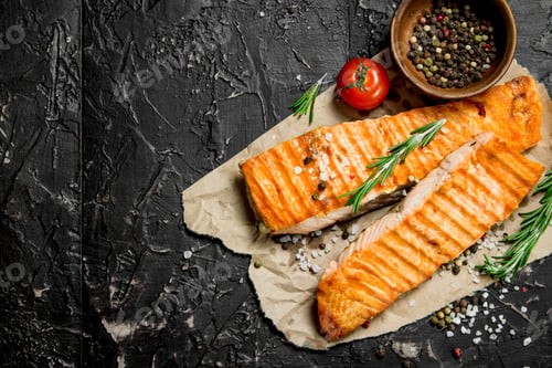 Preview: Grilled salmon fillet with rosemary branches.
