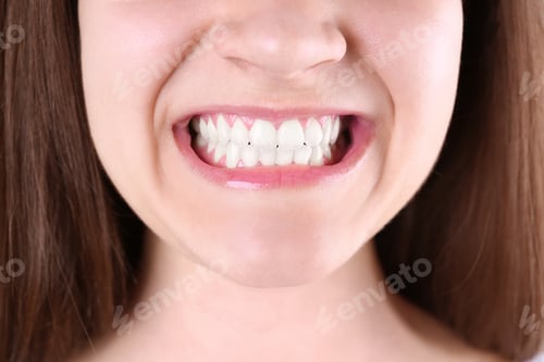 Preview: Young woman with beautiful smile, closeup view