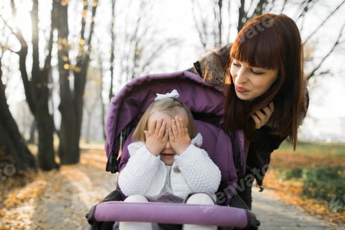 Preview: Walk in autumn park. Happy family, young mother walking with her little cute baby girl