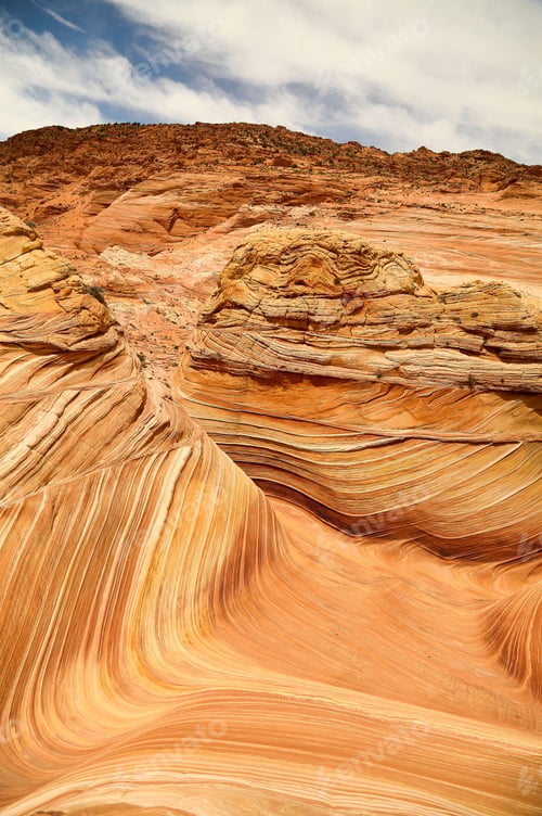 Preview: Beautiful vertical view of sandstone rock formation during the sunrise