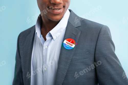 Preview: Man putting on Vote button for Presidential election 2020