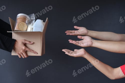 Preview: Hand giving box of various foods