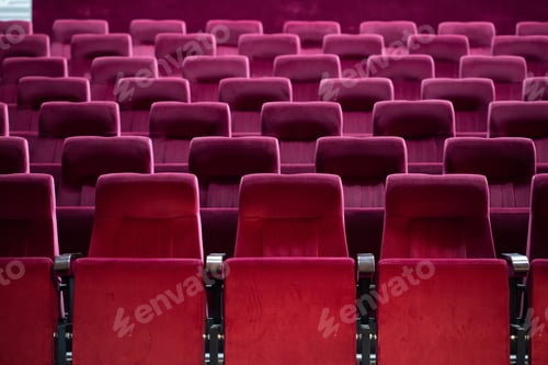 Preview: Empty red chairs for audience in the theater