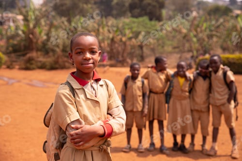 Preview: Black schoolgirl in the courtyard standing in the foreground compared to her classmates