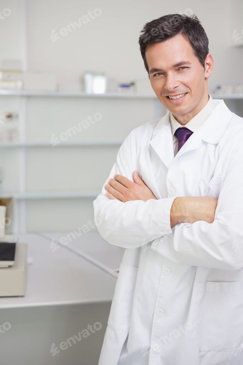 Preview: Mature man in white lab coat standing arms crossed beside benchtop analyzer and shelves, copy space