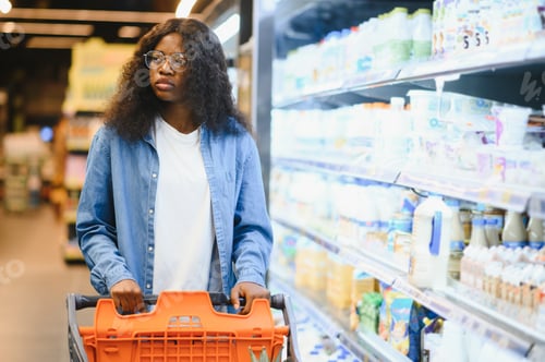 Preview: Happy Black Woman Buyer Doing Groceries Shopping Choosing Food And Buying Products