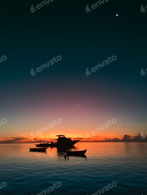 Preview: Orange sunset over yacht and small boats in sea. The colorful sky is reflected on surface of water