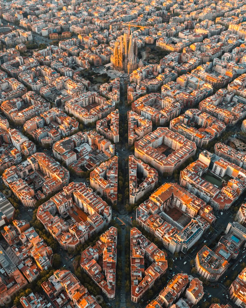 Preview: Aerial view of Barcelona Eixample residential district and Sagrada Familia Basilica at sunrise