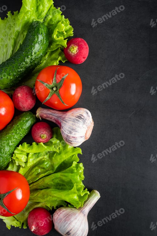 Preview: Fresh vegetables on a dark background. The concept of healthy nutrition and diet