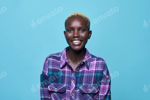 Preview: Happy African American woman against blue background