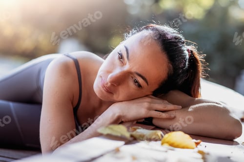 Preview: Fitness woman doing yoga exercises stretching in summer park. Sport Healthy concept.