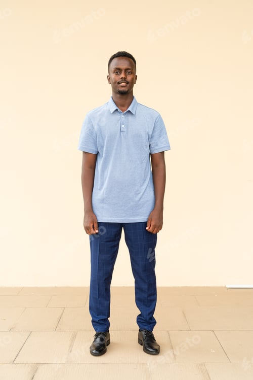 Preview: Full length portrait of young handsome black businessman