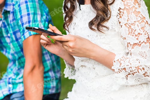 Preview: Couple looking at their smart-phones
