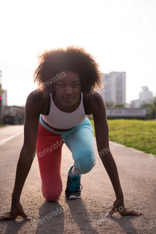 Preview: Portrait of sporty young african american woman running outdoors