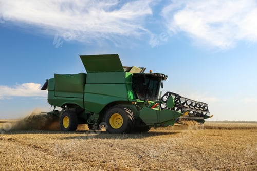 Preview: Modern combine harvester working in agricultural field