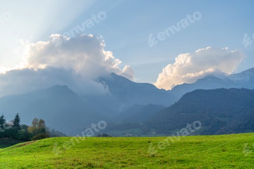 Preview: Beautiful landscape of the layered hazy Italian Alps mountain range during evening. Lombardy, Italy