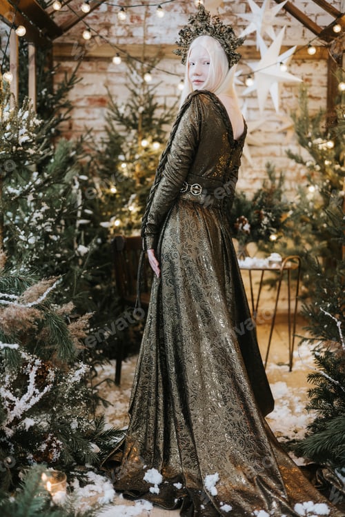 Preview: young albino woman with blue eyes and long white hair in beautiful green dress and crown stands in l