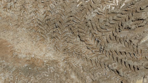 Preview: Aerial top view tire track on dirt sand mud, Texture of wet mud road with puddle and Tyre