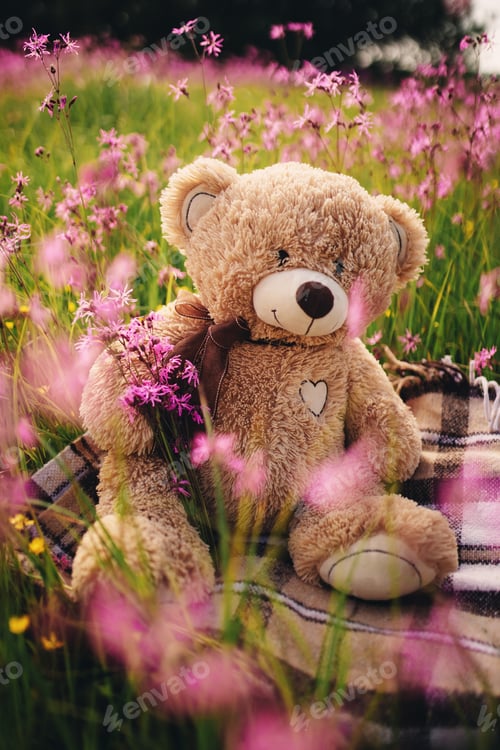 Preview: Teddy bear and a bouquet of lilac flowers. toy bag with a bouquet of flowers. spring flowers