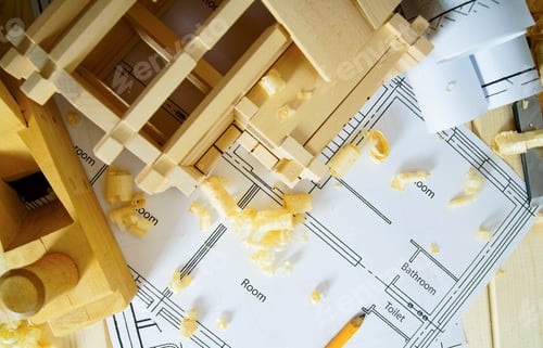 Preview: Joiner's works. Drawings for building, small house and working tools on wooden background.