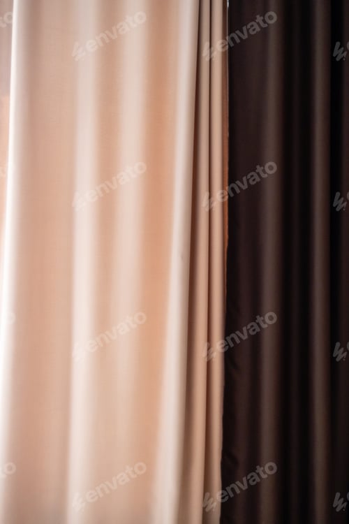 Preview: Beige and brown curtains with soft shadows, showcasing their texture and folds.