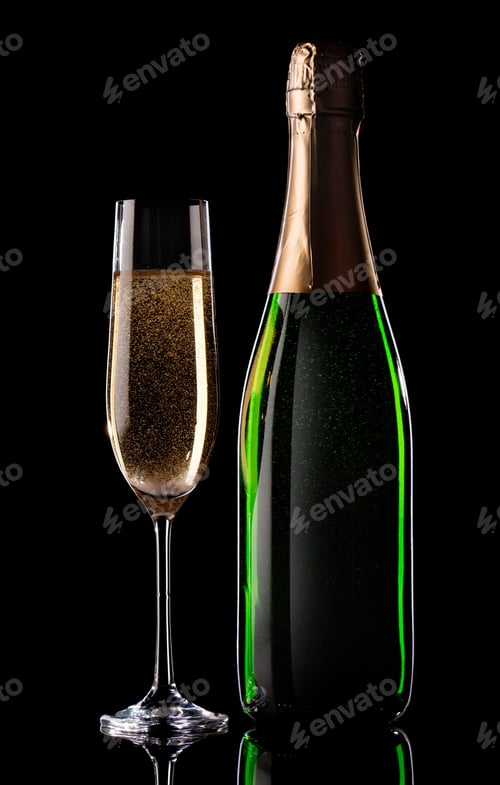 Preview: Sparkling Champagne in Glass Next to Bottle