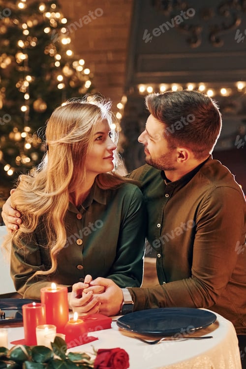 Preview: Conception of relationships. Young lovely couple have romantic dinner indoors together