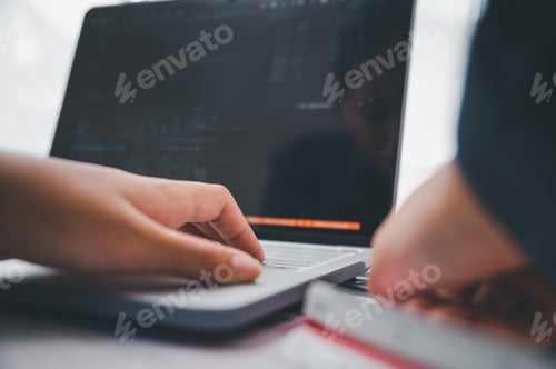 Preview: Graphic designer architects who work with laptops and color comparison tables for design work.