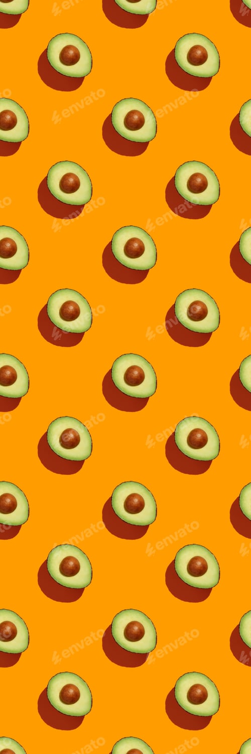 Preview: Avocado on orange background pattern top view flat lay