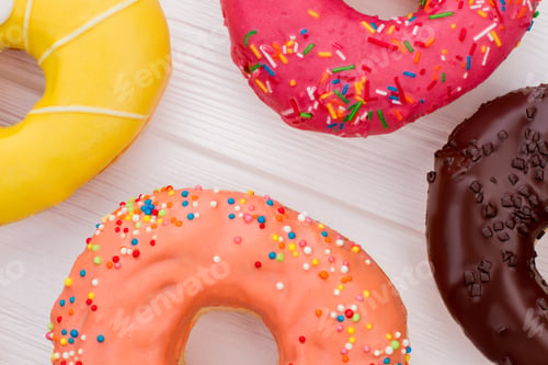 Preview: Close up four different donuts.