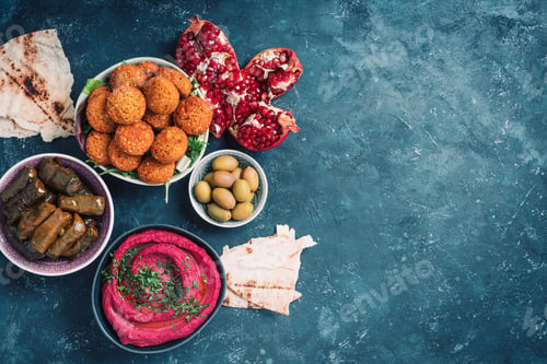 Preview: Traditional Middle Eastern assorted meze: hummus, pita, olives, pistachios, dolma, falafel balls