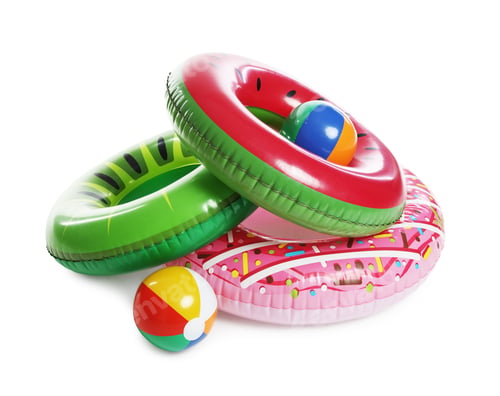 Preview: Different colorful inflatable rings and balls on white background