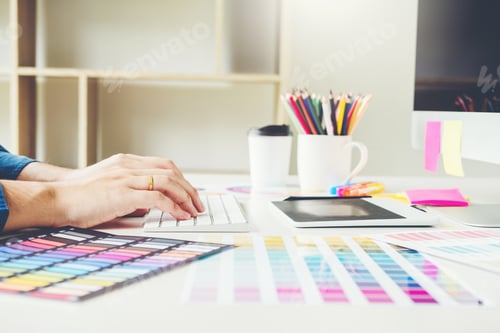 Preview: Graphic designer drawing on graphics tablet at workplace