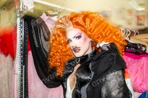 Preview: Vibrant Drag Performer in Colorful Costume Backstage During a Queer Pride Event