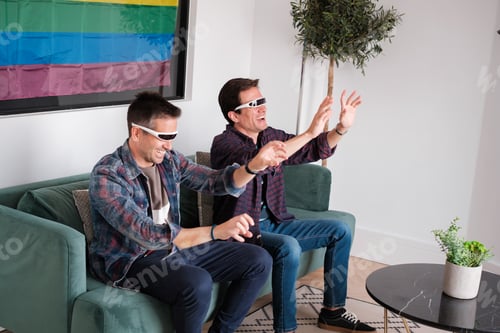 Preview: Young lgtbi couple playing and having fun with virtual reality. Concept: technology, pride, couple
