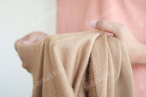 Preview: women holding pink color dirty shirt, showing making stain