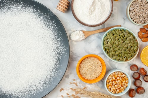 Preview: top view white flour around eggs seeds nuts and jelly on white background food pie cake jam bake